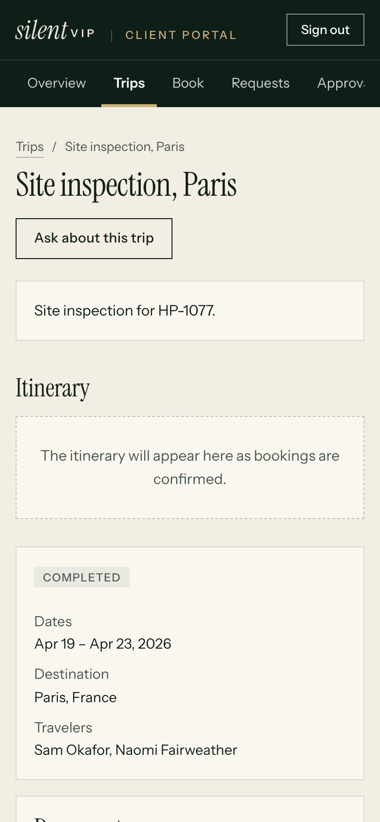 A trip itinerary on a phone screen with flight times and the hotel